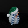 White EVA snowman with green hat